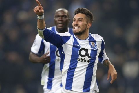 Porto's Alex Telles celebrates after scoring his side's fourth goal during the Champions League group G soccer match between FC Porto and AS Monaco at the Dragao stadium in Porto, Portugal, Wednesday, Dec. 6, 2017. (AP Photo/Luis Vieira)