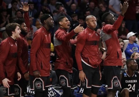 South Carolina players react on the bench during the second half against Florida in the East Regional championship game of the NCAA men's college basketball tournament, Sunday, March 26, 2017, in New York. (AP Photo/Julio Cortez)