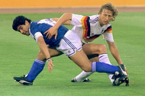 ** FILE ** Argentina's Diego Maradona and West Germany's Guido Buchwald tangle with one another during the World Cup soccer final in Rome on August, 7, 1990, won by the Germans 1-0. Argentina and Germany will meet Friday June 30 in Berlin in a quarterfinal match of the 2006 soccer World Cup. (AP Photo)