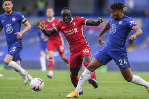 Chelsea's Reece James, right, duels for the ball with Liverpool's Sadio Mane during the English Premier League soccer match between Chelsea and Liverpool at Stamford Bridge Stadium, Sunday, Sept. 20, 2020. (Will Oliver/Pool via AP)