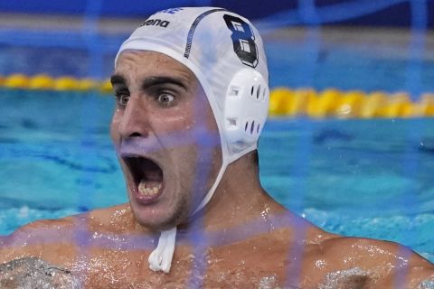 Greece's Stylianos Argyropoulos Kanakakis celebrates after scoring a goal against Hungary during a semifinal round men's water polo match at the 2020 Summer Olympics, Friday, Aug. 6, 2021, in Tokyo, Japan. (AP Photo/Mark Humphrey)