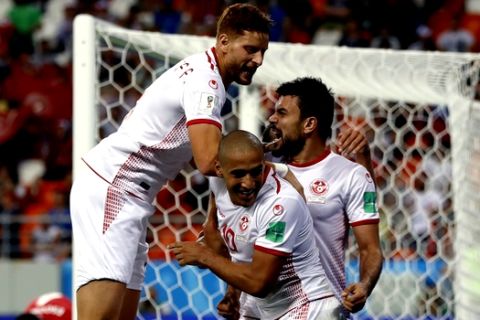 Tunisia's Wahbi Khazri, center, celebrates with his teammates after scoring his side's second goal during the group G match between Panama and Tunisia at the 2018 soccer World Cup at the Mordovia Arena in Saransk, Russia, Thursday, June 28, 2018. (AP Photo/Darko Bandic)