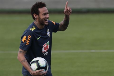 Brazil's soccer player Neymar smiles during a practice at the Granja Comary training center ahead the Copa America tournament in Teresopolis, Brazil, Saturday, May 25, 2019. (AP Photo/Silvia Izquierdo)