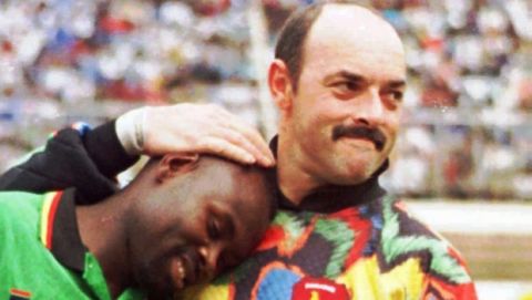 Zimbabwean goalkeeper Bruce Grobbelaar, right, plays the fool with teammate Dumisani Mpofu prior to an African Nations Cup qualifying match against Ghana, in  Harare, Sunday January 26, 1997. Grobbelaar is currently on trial in England on chages related to match fixing. (AP Photo/Sarah-Jane Bullock)