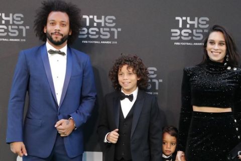 Brazil's soccer player Marcelo and his family arrive for the ceremony of the Best FIFA Football Awards in the Royal Festival Hall in London, Britain, Monday, Sept. 24, 2018. (AP Photo/Frank Augstein)