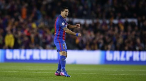 Barcelona's Luis Suarez celebrates scoring the opening goal during the Champion's League round of 16, second leg soccer match between FC Barcelona and Paris Saint Germain at the Camp Nou stadium in Barcelona, Spain, Wednesday March 8, 2017. (AP Photo/Manu Fernandez)
