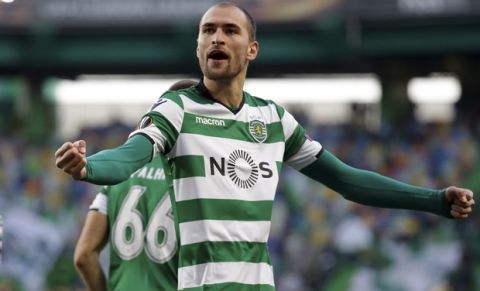 Sporting's Bas Dost celebrates after scoring the opening goal during the Europa League round of 32 second leg soccer match between Sporting CP and Astana at the Alvalade stadium in Lisbon, Thursday Feb. 22, 2018. (AP Photo/Armando Franca)