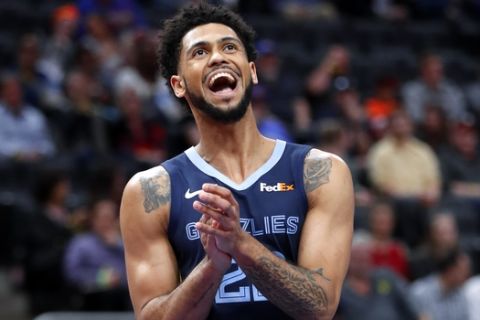 Memphis Grizzlies guard Tyler Dorsey (22) reacts to a play against the Detroit Pistons in the first half of an NBA basketball game in Detroit, Tuesday, April 9, 2019. (AP Photo/Paul Sancya)