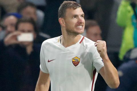 Roma's Edin Dzeko celebrates after scoring during the Champions League group C soccer match between Chelsea and Roma at Stamford Bridge stadium in London, Wednesday, Oct. 18, 2017. (AP Photo/Frank Augstein)