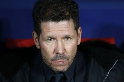 Atletico Madrid coach Diego Simeone looks out from the bench prior a Group A Champions League soccer match between Atletico Madrid and Monaco at the Metropolitano stadium in Madrid, Wednesday, Nov. 28, 2018. (AP Photo/Paul White)