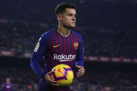 FC Barcelona's Coutinho holds a ball during the Spanish La Liga soccer match between FC Barcelona and Leganes at the Camp Nou stadium in Barcelona, Spain, Sunday, Jan. 20, 2019. (AP Photo/Manu Fernandez)