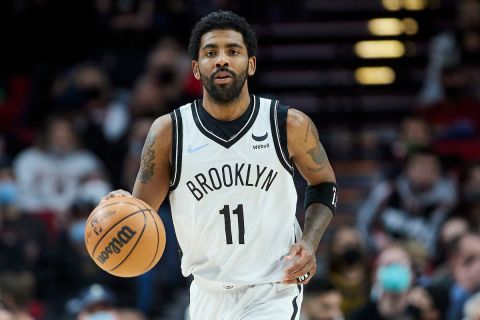 Brooklyn Nets guard Kyrie Irving dribbles the ball against the Portland Trail Blazers during the second half of an NBA basketball game in Portland, Ore., Monday, Jan. 10, 2022. (AP Photo/Craig Mitchelldyer)