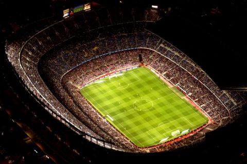 In this photo dated Tuesday, Sept. 19, 2017, the Camp Nou stadium is seen illuminated ahead of a soccer match between Barcelona F.C and Eibar in Barcelona, Spain, Tuesday, Sept. 19, 2017.  The Camp Nou Stadium in Barcelona is not only one of soccer's biggest and most famous venues but also a tremendous echo chamber for Catalans who want independence from Spain, the rallying cry seeming to become louder than usual with the prosperous region locked in a struggle with the government in Madrid.  When Barcelona plays, fans chant "Independence!",  generally 17 minutes and 14 seconds into every match, to mark the year, 1714, when Spain first took away self-rule from Catalonia.(AP Photo/Emilio Morenatti)