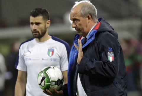 Italy coach Gian Piero Ventura gives directions to his players as Italy's Lorenzo Insigne, left, listens prior to the World Cup qualifying play-off second leg soccer match between Italy and Sweden, at the Milan San Siro stadium, Italy, Monday, Nov. 13, 2017. (AP Photo/Luca Bruno)