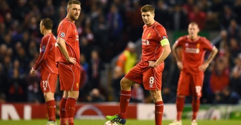 LIVERPOOL, ENGLAND - DECEMBER 09: (R-L) Dejected Liverpool players Rickie Lambert and Steven Gerrard look on after conceding the opening goal during the UEFA Champions League group B match between Liverpool and FC Basel 1893 at Anfield on December 9, 2014 in Liverpool, United Kingdom.  (Photo by Laurence Griffiths/Getty Images)