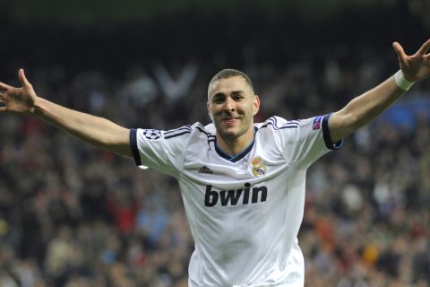 Real Madrid's French forward Karim Benzema celebrates after scoring during the UEFA Champions League quarter-final first leg football match Real Madrid vs Galatasaray on April 3,2013 at the Santiago Bernabeu stadium in Madrid.  AFP PHOTO / CURTO DE LA TORRE        (Photo credit should read CURTO DE LA TORRE/AFP/Getty Images)