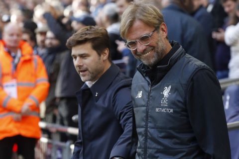 head coach Mauricio Pochettino , left, and Liverpool head coach Juergen Klopp prior to the English Premier League soccer match between Tottenham Hotspur and Liverpool at Wembley Stadium in London, Sunday, Oct. 22, 2017.(AP Photo/Frank Augstein)
