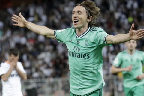 Real Madrid's Luka Modric celebrates after scoring his side's third goal during the Spanish Super Cup semifinal soccer match between Real Madrid and Valencia at King Abdullah stadium in Jiddah, Saudi Arabia, Wednesday, Jan. 8, 2020. (AP Photo/Hassan Ammar)