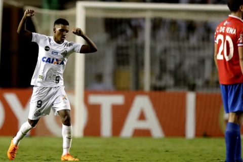 Rodrygo of Brazil's Santos, left, celebrates after scoring against Uruguay's Nacional, during a Copa Libertadores soccer match in Sao Paulo, Brazil, Thursday, March 15, 2018. (AP Photo/Andre Penner)