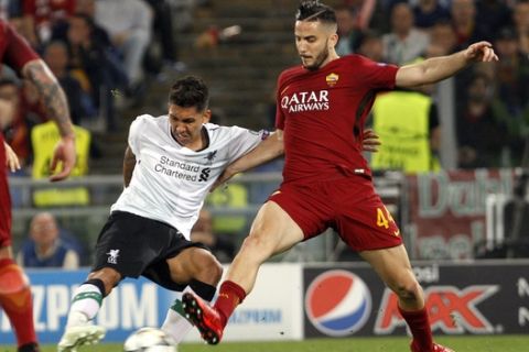 Liverpool's Roberto Firmino, left, is challenged by Roma's Kostas Manolas during the Champions League semifinal second leg soccer match between Roma and Liverpool at the Olympic Stadium in Rome, Wednesday, May 2, 2018. (AP Photo/Riccardo De Luca)
