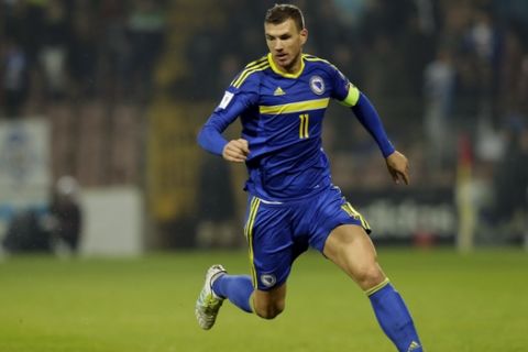 Bosnia's Edin Dzeko, controls the ball during their World Cup Group H qualifying soccer match against Cyprus at the Bilino Polje Stadium in Zenica on Monday, Oct. 10, 2016. (AP Photo/Amel Emric)