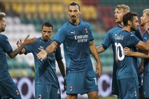 AC Milan's Zlatan Ibrahimovic, center, celebrates with his teammates after he scored his side's first goal during an Europa League second qualifying round soccer match between Shamrock Rovers and AC Milan at the Tallaght Stadium in Dublin, Thursday, Sept. 17, 2020. (AP Photo/Peter Morgan)