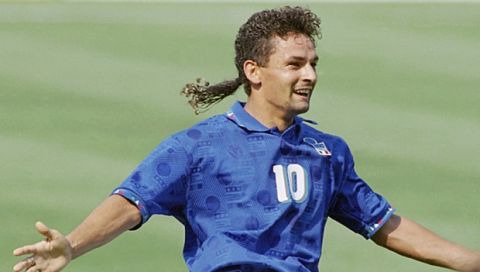FILE - In this July 13, 1994 file photo, Italy's Roberto Baggio celebrates after scoring during the semifinal World Cup soccer match, Italy vs. Bulgaria at Giants Stadium, East Rutherford, N.J. Legendary Italian striker Roberto Baggio marked his 50th birthday on Saturday, Feb. 18, 2017 by visiting towns devastated by a series of earthquakes last year. Baggio, who is regarded as one of the best ever players, opted not to celebrate surrounded by celebrities but instead spent the day in Amatrice, which was almost wiped out by the Aug. 24 earthquake. (AP Photo/Michael Probst/File)
