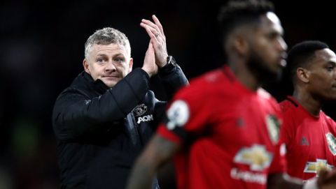 Manchester United manager Ole Gunnar Solskjaer applauds the fans after the English Premier League soccer match between Manchester United and Wolverhampton Wanderers, at Old Trafford, in Manchester, England, Saturday, Feb. 1, 2020. (Martin Rickett/PA via AP)