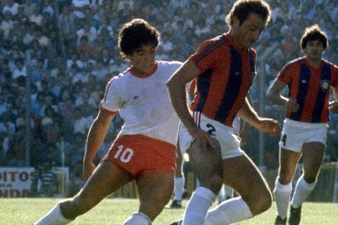 **FILE** Diego Maradona, left, playing for his first team, Argentinos Juniors,  battles for the ball with an unidentified player of San Lorenzo de Almagro in this Feb. 17, 1980 file photo. Maradona was responding to treatment for heart and blood pressure problems on Tuesday, April 20, 2004 doctors said, two days after the soccer star was admitted to the hospital. (AP Photo/Eduardo Di Baia)