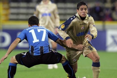 Club Brugge player Marcos Camozzato challenges NK Dinamo Zagreb player Luis Ibanez, during the Europa League group D match, in Bruges, Belgium, Thursday, Nov. 4, 2010. (AP Photo/Francois Walschaerts)