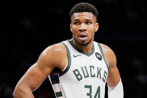 Milwaukee Bucks forward Giannis Antetokounmpo (34) stands on court during the second half of the team's NBA basketball game against the Brooklyn Nets in New York, Wednesday, Dec. 27, 2023. (AP Photo/Peter K. Afriyie)