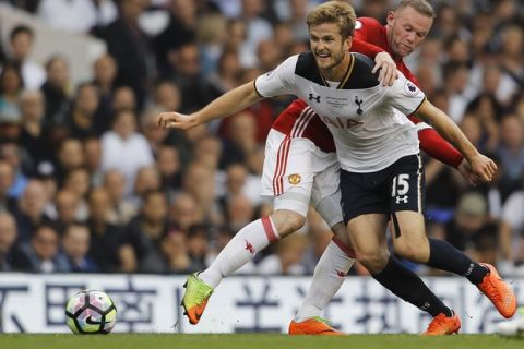 Tottenham's Eric Dier, right, competes for the ball with Manchester United's Wayne Rooney during the English Premier League soccer match between Tottenham Hotspur and Manchester United at White Hart Lane stadium in London, Sunday, May 14, 2017. (AP Photo/Frank Augstein)