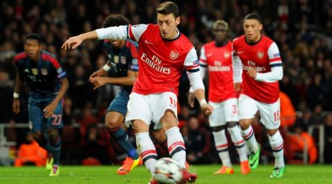 LONDON, ENGLAND - FEBRUARY 19:  Mesut Oezil of Arsenal misses from the penalty spot during the UEFA Champions League Round of 16 first leg match between Arsenal and FC Bayern Muenchen at Emirates Stadium on February 19, 2014 in London, England.  (Photo by Shaun Botterill/Getty Images)