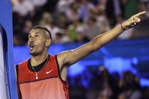 Nick Kyrgios of Australia gestures as he argues with the umpire during his third round match against  Tomas Berdych of the Czech Republic at the Australian Open tennis championships in Melbourne, Australia, Friday, Jan. 22, 2016.(AP Photo/Aaron Favila)