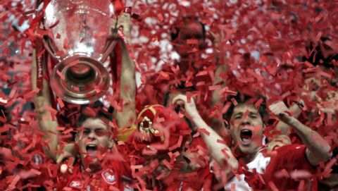 Liverpool's captain Steven Gerrard, left, holds the trophy after Liverpool's victory in the the UEFA Champions League Final between AC Milan and Liverpool at the Ataturk Olympic Stadium in  Istanbul, Turkey,Wednesday May 25, 2005. Liverpool won the match 3-2 on penalties.(AP Photo/Dusan Vranic)