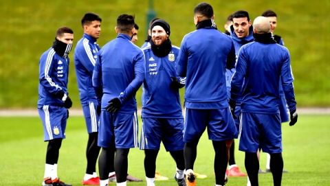 Argentina's Lionel Messi, center, attends a training session with teammates at the City Football Academy, Manchester, England, Tuesday March 20, 2018. Argentina will play Italy in an international friendly on Friday. (Dave Howarth//PA via AP)