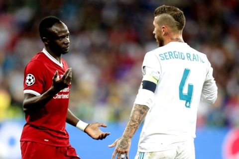 Liverpool's Sadio Mane, left, argues with Real Madrid's Sergio Ramos during the Champions League Final soccer match between Real Madrid and Liverpool at the Olimpiyskiy Stadium in Kiev, Ukraine, Saturday, May 26, 2018. (AP Photo/Efrem Lukatsky)
