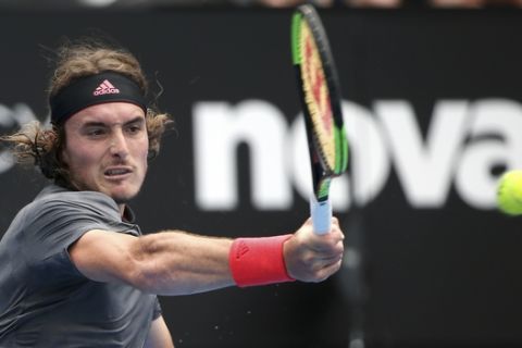 Stefanos Tsitsipas of Greece hits a forehand to Andreas Seppi of Italy during their men's singles match at the Sydney International tennis tournament in Sydney, Thursday, Jan. 10, 2019. (AP Photo/Rick Rycroft)