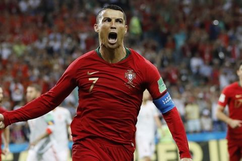 Portugal's Cristiano Ronaldo celebrates his side's opening goal during the group B match between Portugal and Spain at the 2018 soccer World Cup in the Fisht Stadium in Sochi, Russia, Friday, June 15, 2018. (AP Photo/Francisco Seco)