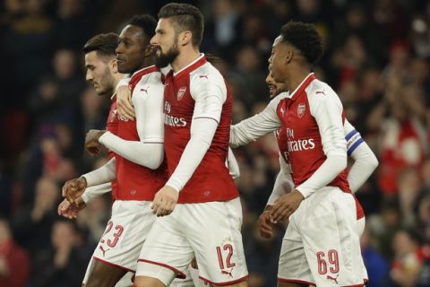 Arsenal's Danny Welbeck, second left, celebrates with teammates after scoring the opening goal of the game during the English League Cup quarterfinal soccer match between Arsenal and West Ham United at the Emirates stadium in London, Tuesday, Dec. 19, 2017. (AP Photo/Alastair Grant)