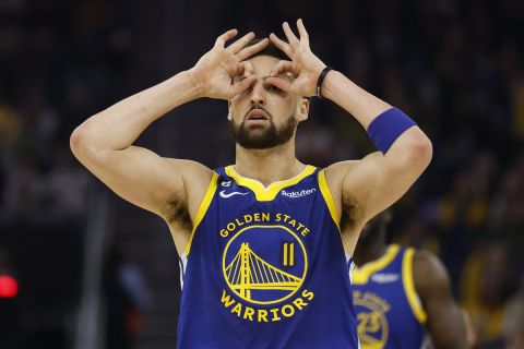 Golden State Warriors guard Klay Thompson (11) celebrates after a making a 3-point basket against the Atlanta Hawks during the first half of an NBA basketball game in San Francisco, Monday, Jan. 2, 2023. (AP Photo/Jed Jacobsohn)