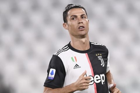 Juventus' Cristiano Ronaldo in action during the Serie A soccer match between Juventus and Lecce, at the Allianz Stadium in Turin, Italy, Friday, June 26, 2020. (Fabio Ferrari/LaPresse via AP)