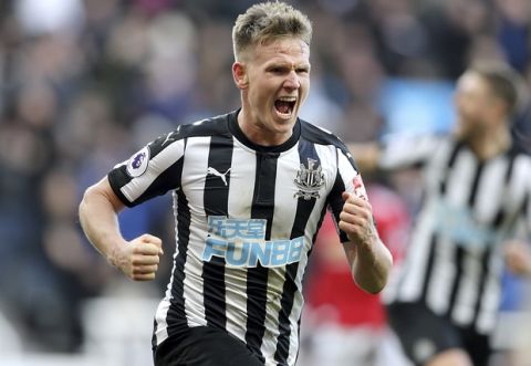 Newcastle United's Matt Ritchie celebrates scoring his side's first goal of the game during their English Premier League soccer match against Manchester United at St James' Park, Newcastle, England, Sunday, Feb. 11, 2018. (Owen Humphreys/PA via AP)