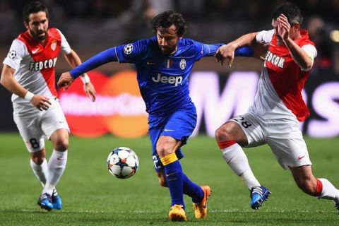 MONACO - APRIL 22:  Andrea Pirlo of Juventus is challenged by Jeremy Toulalan of Monaco watched by Joao Moutinho (L) of Monaco during the UEFA Champions League quarter-final second leg match between AS Monaco FC and Juventus at Stade Louis II on April 22, 2015 in Monaco, Monaco.  (Photo by Laurence Griffiths/Getty Images)