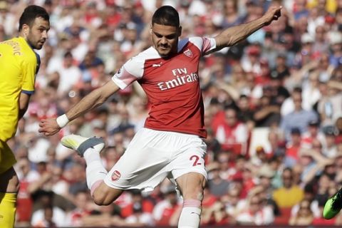 Arsenal's Konstantinos Mavropanos, center, has a shot during the English Premier League soccer match between Arsenal and Crystal Palace at the Emirates Stadium in London, Sunday, April 21, 2019. (AP Photo/Tim Ireland)