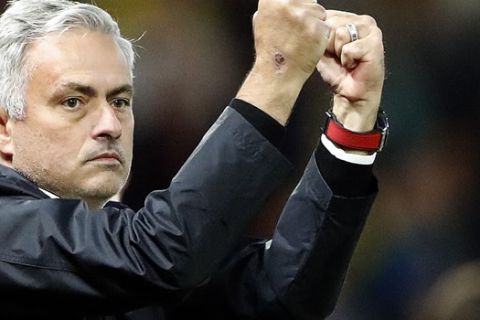 Manchester United head coach Jose Mourinho gestures after his team won the English Premier League soccer match between Watford and Manchester United at Vicarage Road stadium in Watford, England, Saturday, Sept. 15, 2018.(AP Photo/Frank Augstein)