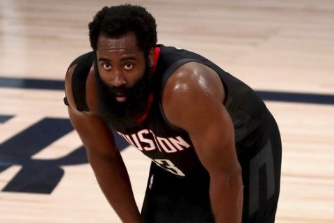 Houston Rockets guard James Harden takes a breather during the second half of Game 4 of an NBA basketball first-round playoff series, Monday, Aug. 24, 2020, in Lake Buena Vista, Fla. (Kim Klement/Pool Photo via AP)