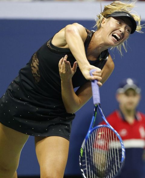 Maria Sharapova, of Russia, follows through on a serve during the opening round of the U.S. Open tennis tournament in New York, Monday, Aug. 28, 2017. (AP Photo/Kathy Willens)