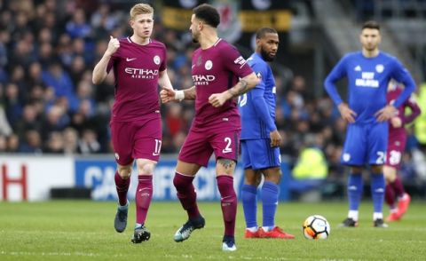 Manchester City's Kevin De Bruyne, left, gestures after scoring the opening goal during the English FA Cup fourth round soccer match between Cardiff City and Manchester City at Cardiff City stadium in Cardiff, Wales, Sunday, Jan. 28, 2018. (AP Photo/Kirsty Wigglesworth)