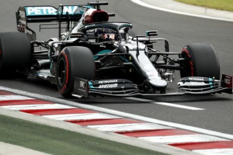 Mercedes driver Lewis Hamilton of Britain steers his car during the qualifying session for the Hungarian Formula One Grand Prix at the Hungaroring racetrack in Mogyorod, Hungary, Saturday, July 18, 2020. The Hungarian F1 Grand Prix will be held on Sunday. (Darko Bandic/Pool)